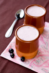 Homemade yogurt with berries in a ceramic bowl