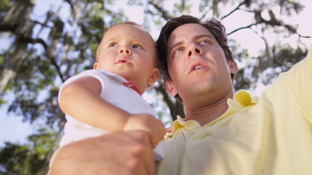Young Father Toddler Son Outdoors Close Up