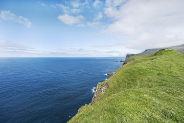 Steep green cliffs over the Atlantic Ocean