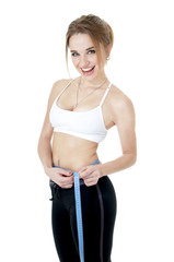 Athletic woman measuring her body on white background. Weight lo