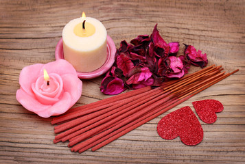 Spa. Burning candles with dried roses leaves, incense sticks