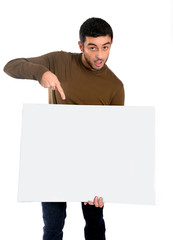 Attractive man showing and pointing blank billboard