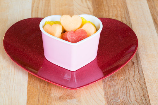 Valentines Day healthy treat with heart-shaped fruit 