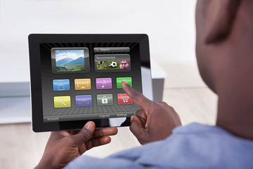 Fototapeta na wymiar Person Holding Digital Tablet