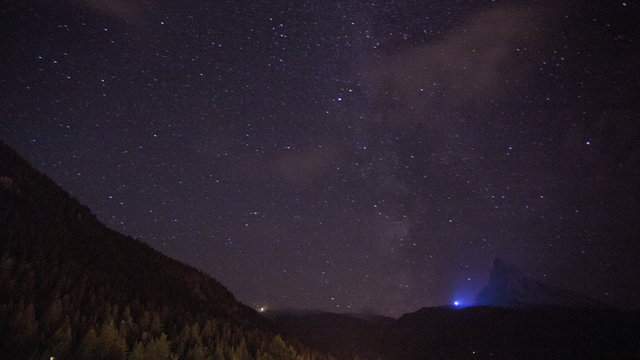 Motion time lapse stars in the night sky over Matterhorn, Zermatt, 