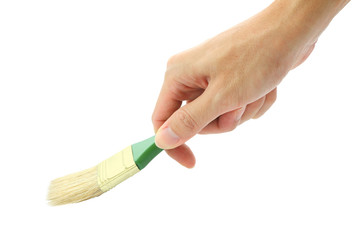 Hand hold green handler brush painting on white background.