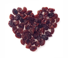 Fototapeta premium heart shape from raisins on white background