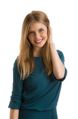 Young girl wearing elegant dress posing against white background