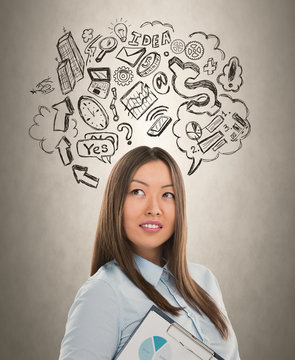 Young business woman thinking of her plans closeup face portrait