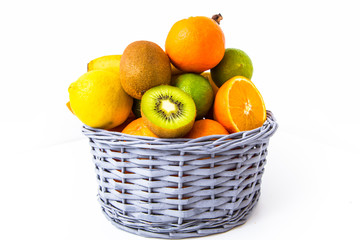 fruits in wicker basket isolated on white background