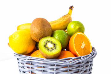 Fruit in wicker basket isolated on white backgroung