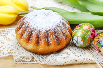 Easter cake and yellow tulips on the table