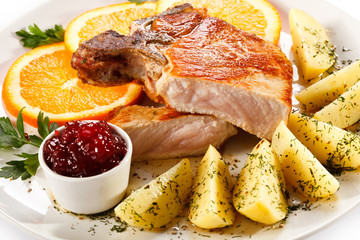 Grilled steak, boiled potatoes and lingonberry jam