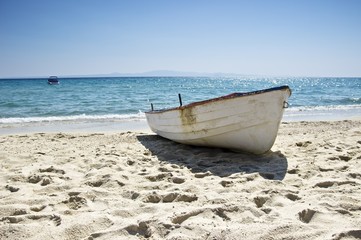 Lonely fishing boat at the seashore