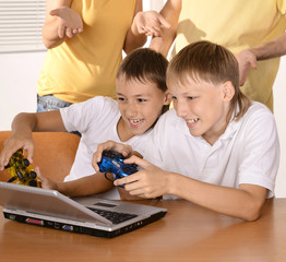 Kids playing  on notebook