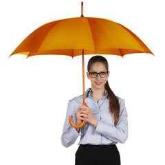 Happy woman standing under a large umbrella