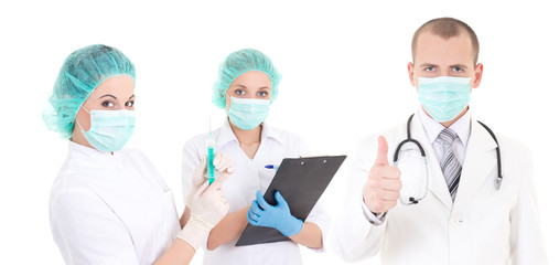 team of surgeons in green masks isolated on white