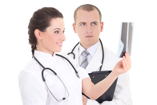 young female and male doctors with xray isolated on white