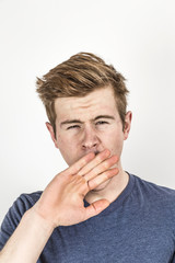 cool boy with red hair posing in studio