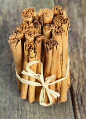 ceylon cinnamon sticks on wooden surface