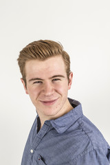 Obraz premium cool boy with red hair posing in studio
