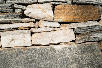 Wall built of stones. Sun light