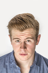 Obraz premium cool boy with red hair posing in studio