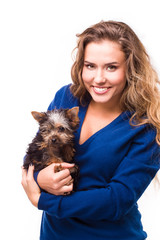 young woman holding Yorkshire terrier dog