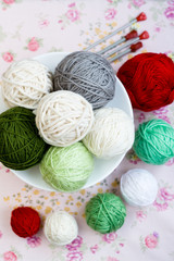 A lot of bright balls of knitting on the background