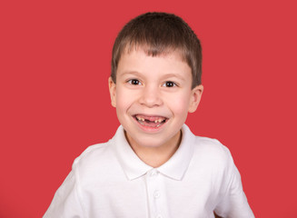 boy portrait in white shirt on red
