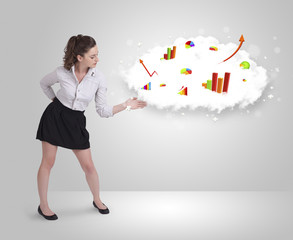 Fototapeta premium Young woman presenting cloud with graphs and charts