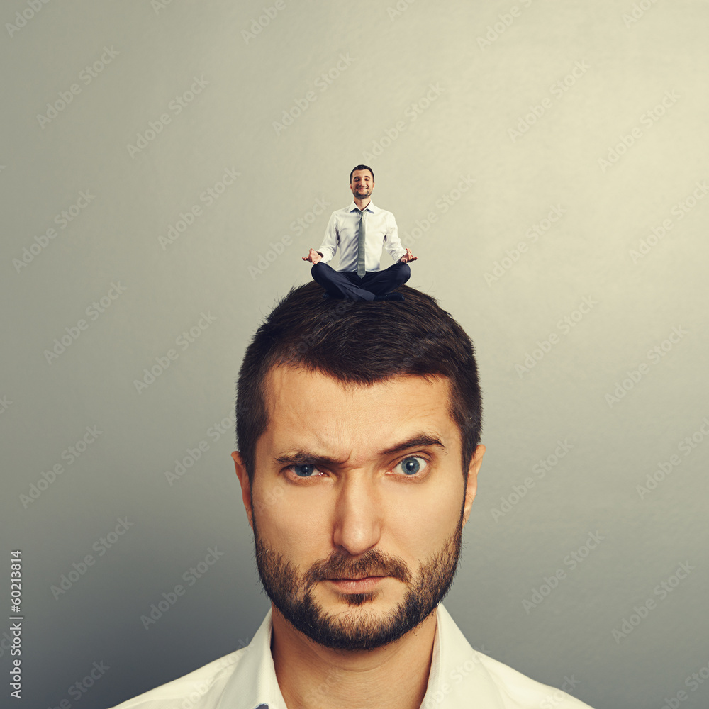 Poster small man sitting on the head big man