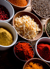 Assorted spices on wooden background
