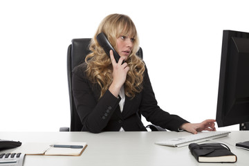 Young businesswoman multitasking