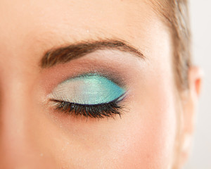Woman eye with exotic style makeup.