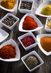 Assorted spices on wooden background