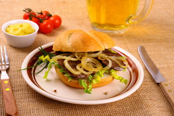 Ochsen Semmel - Grilled beef with onion rings in bun