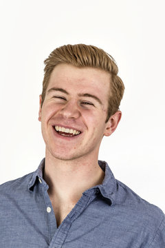 cool boy with red hair posing in studio