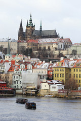 Snowy Prague gothic Castle above River Vltava, Czech Republic