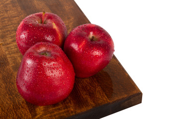 Fresh juicy water-sprinkled apples on white background