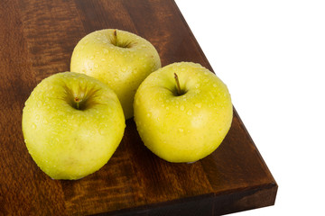 Fresh juicy water-sprinkled apples on white background