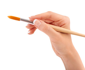 Female hand holding paint brush isolated