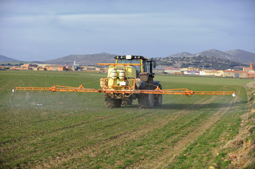 Fototapeta premium tractor spraying