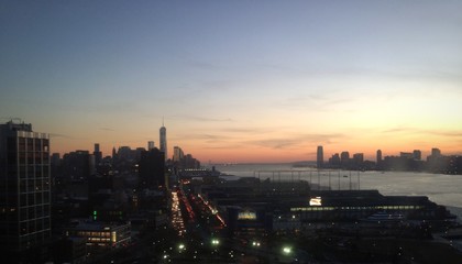 Fototapeta na wymiar new york city sunset freedom tower downtown manhattan nj nyc