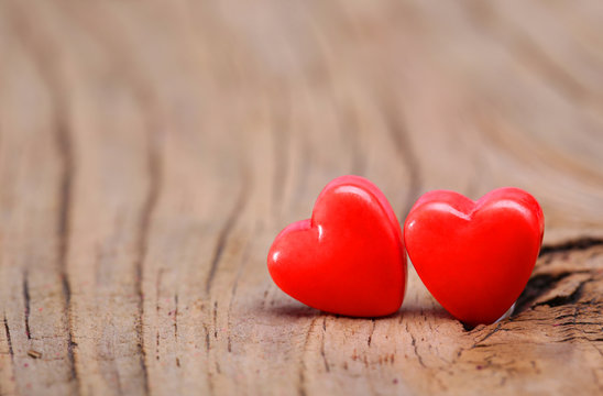 Hearts on Wooden Texture. Valentines Day background. Macro.