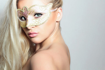 Beautiful Blond Woman in a Carnival Mask.Masquerade. Sexy Girl
