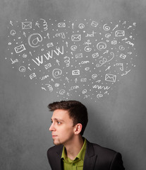 Businessman thinking with social network icons above his head