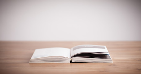 Open book on wooden deck