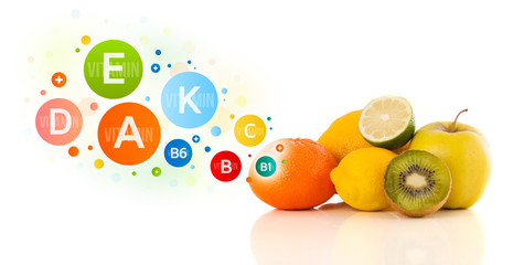 Healthy fruits with colorful vitamin symbols and icons © ra2 studio