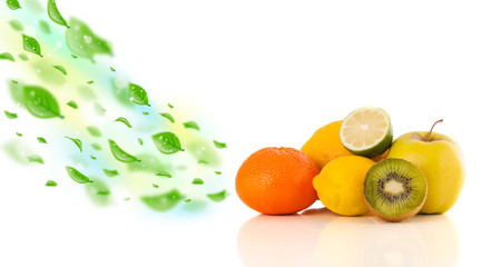 Fototapeta na wymiar Colorful fruits with green organic leafs
